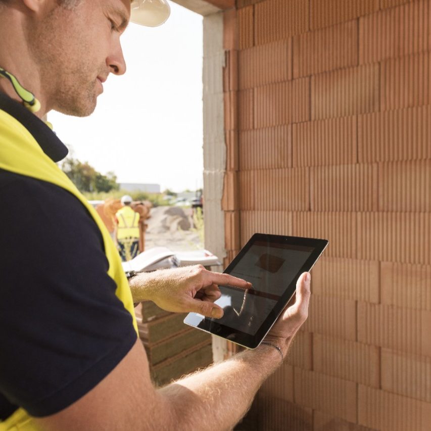 Construction worker with tablet computer