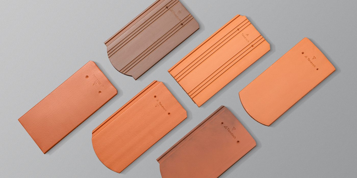 Tondach tetőcserepek szürke háttérrel