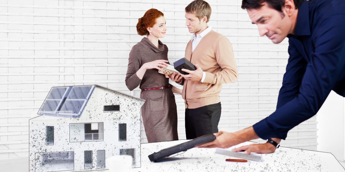 Father protecting little girl while learning to ride the bike while mother watches them